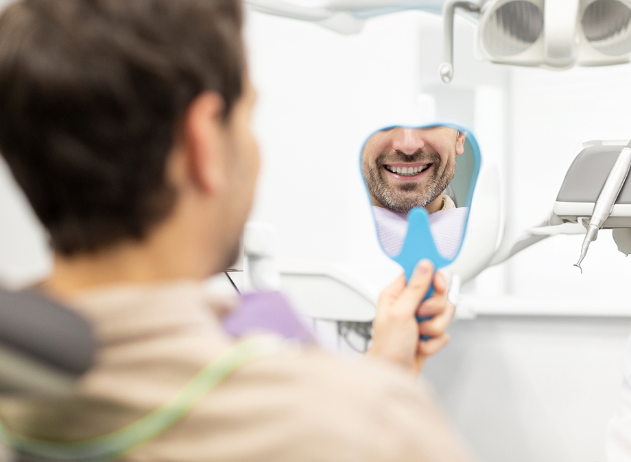 man looking at himself in the mirror